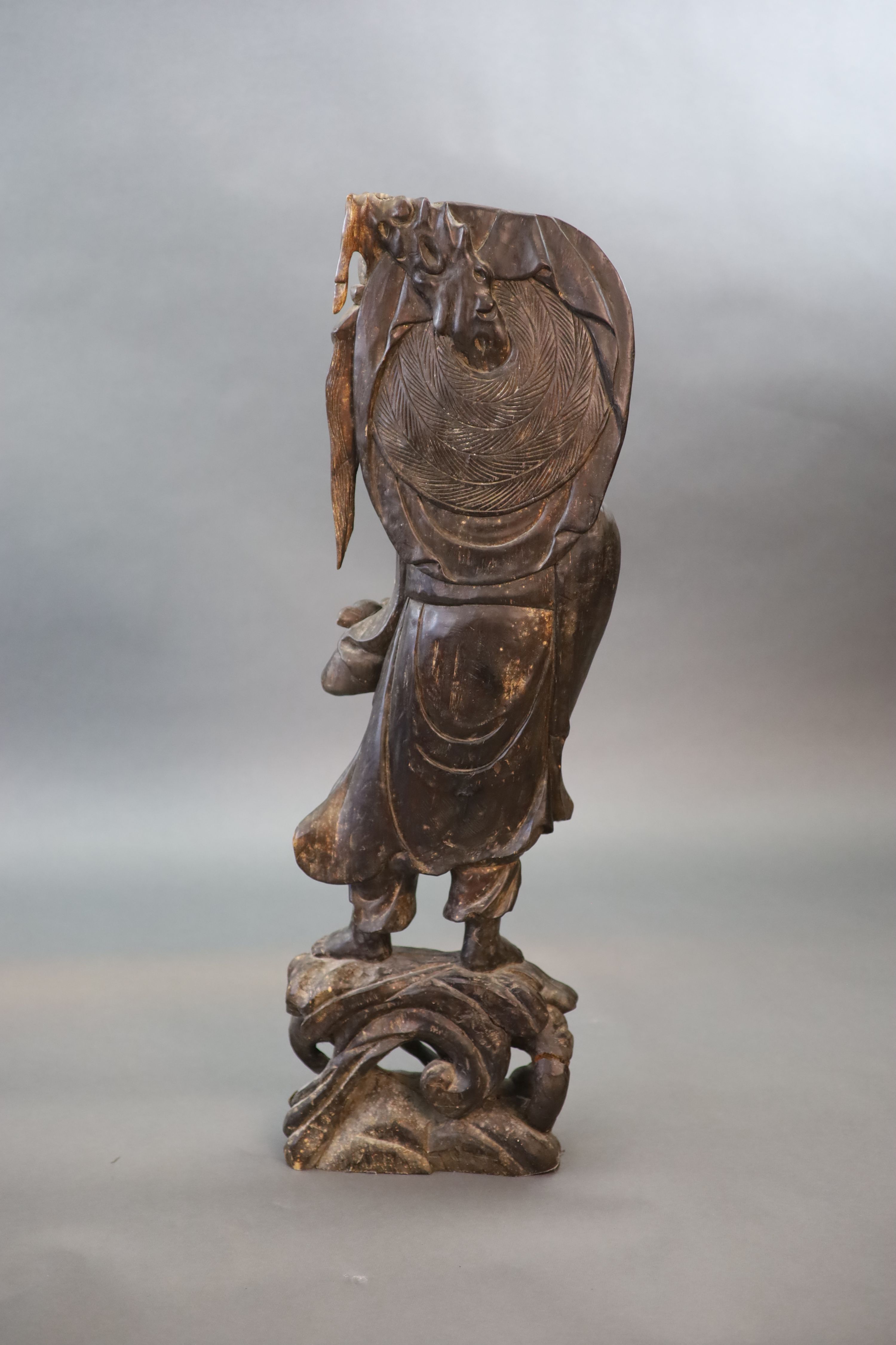 An early 20th Chinese carved hardwood figure of a Luohan